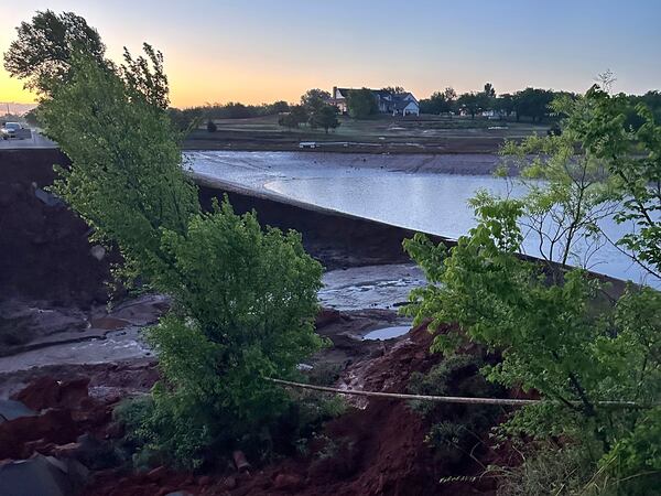 A washed-out roadway from flash-flooding is seen in Grady County, Okla., on Thursday, May 1, 2025, that left about 10 families stranded in their homes. (John Teas via AP)