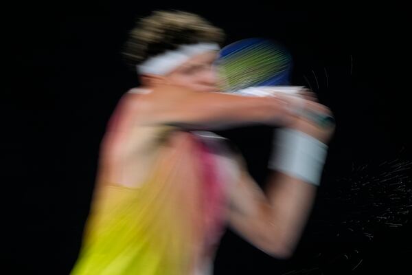 Ben Shelton of the U.S. plays a backhand return to Jannik Sinner of Italy during their semifinal match at the Australian Open tennis championship in Melbourne, Australia, Friday, Jan. 24, 2025. (AP Photo/Asanka Brendon Ratnayake)