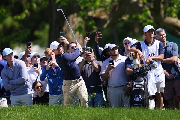 Rory McIlroy, of Northern Ireland, watches his shot on the seventh hole during the third round of the Truist Championship golf tournament at the Philadelphia Cricket Club, Saturday, May 10, 2025, in Flourtown. (AP Photo/Matt Rourke)