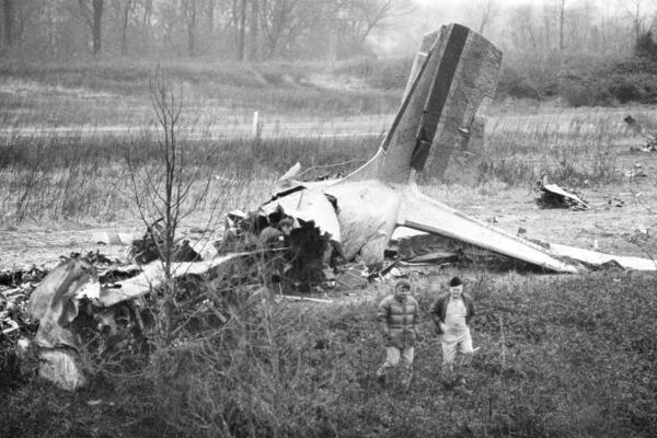 FILE - Wreckage of a DC-3 which crashed on takeoff from Dress Regional Airport in Evansville, Ind., lies on top of a ridge adjoining railroad tracks, Dec. 14, 1977. Twenty-nine people died in the crash, including members of the University of Evansville basketball team. (AP Photo/File)