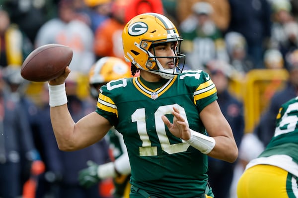 Green Bay Packers quarterback Jordan Love (10) passes against the Chicago Bears during the first half of an NFL football game, Sunday, Jan. 5, 2025, in Green Bay, Wis. (AP Photo/Mike Roemer)