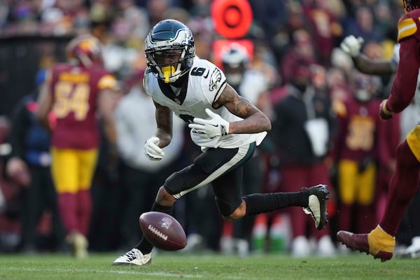 Philadelphia Eagles wide receiver DeVonta Smith (6) drops a pass during the second half of an NFL football game against the Washington Commanders, Sunday, Dec. 22, 2024, in Landover, Md. (AP Photo/Stephanie Scarbrough)