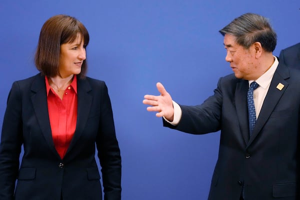 Chinese Vice Premier He Lifeng, right, gestures to Britain's Chancellor of the Exchequer Rachel Reeves and Chinese Vice Premier He Lifeng pose for a group photo before the start of the 11th China - UK Economy and Finance Dialogue in Beijing, Saturday, Jan. 11, 2025. (AP Photo/Aaron Favila, Pool)