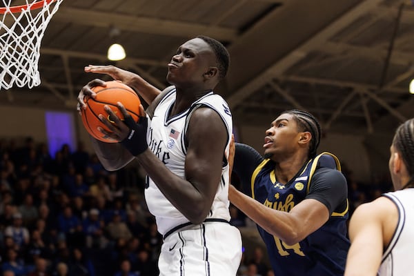 Duke's Khaman Malauch (9) grabs a rebound ahead of Notre Dame's Kebba Njie (14) during the first half of an NCAA college basketball game in Durham, N.C., Saturday, Jan. 11, 2025. (AP Photo/Ben McKeown)