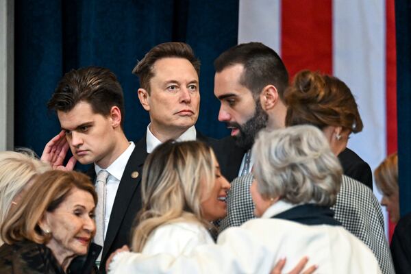 Elon Musk, right, arrives before the 60th Presidential Inauguration in the Rotunda of the U.S. Capitol in Washington, Monday, Jan. 20, 2025. (Kenny Holston/The New York Times via AP, Pool)