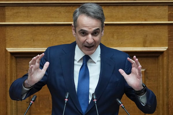 FILE - Greek Prime Minister Kyriakos Mitsotakis speaks in parliament ahead of the submission of a no-confidence motion by opposition parties over the government's handling of Greece's worst rail disaster two year ago, in Athens, Wednesday, March 5, 2025. Greece's conservative government has announced a major cabinet reshuffle on Friday, March 14, 2025 following declining approval ratings linked to the deadly 2023 rail disaster. (AP Photo/Thanassis Stavrakis, File)