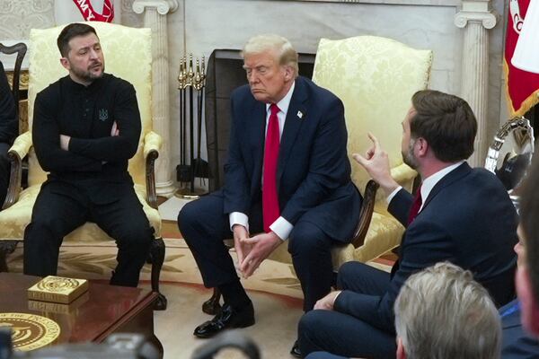 FILE - Vice President JD Vance, right, speaks with Ukrainian President Volodymyr Zelenskyy, left, as President Donald Trump listens in the Oval Office at the White House, Feb. 28, 2025, in Washington. (AP Photo/ Mystyslav Chernov, File)