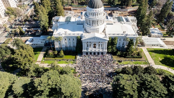 Several hundred demonstrators rally against President Donald Trump outside the California State Capitol on Wednesday, Feb. 5, 2025, in Sacramento, Calif. (AP Photo/Noah Berger)