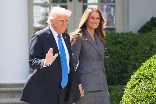 President Donald Trump and first lady Melania Trump arrive in the Rose Garden at the White House, Monday, May 19, 2025 in Washington, where President Trump will sign the "Take It Down Act". (AP Photo/Manuel Balce Ceneta)