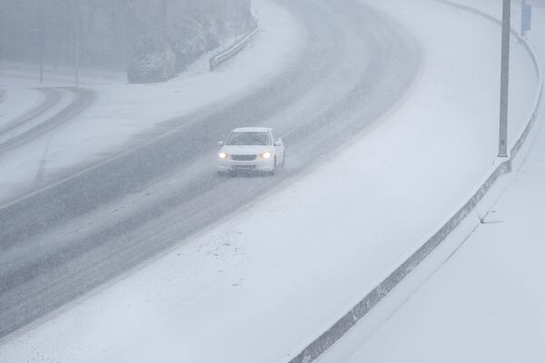 Traffic along Interstate 40 is seen in the snow Friday, Jan 10, 2025, in Nashville, Tenn. (AP Photo/George Walker IV)