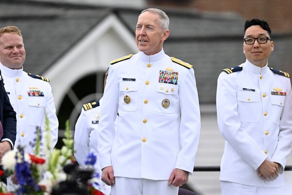 Homeland Security Secretary Kristi Noem announces Admiral Kevin E. Lunday, center, as Commandant, United States Coast Guard at the commencement for the United States Coast Guard Academy, Wednesday, May 21, 2025 in New London, Conn. Lunday has been Acting Commandant since January of 2025. (AP Photo/Jessica Hill)