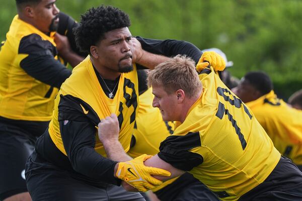 Pittsburgh Steelers first round draft pick Derrick Harmon, left, works against veteran Jacob Slade (79) during the NFL football team's rookie camp in Pittsburgh, Friday, May 9, 2025. (AP Photo/Gene J. Puskar)