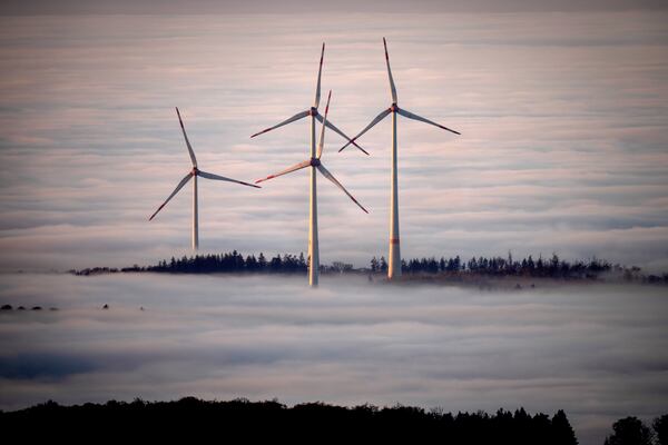 FILE - Wind turbines are surrounded by fog in the Taunus region near Frankfurt, Germany, Nov. 10, 2024. (AP Photo/Michael Probst, File)