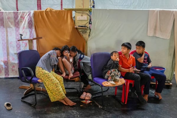 Kuki tribal children sit in a relief camp in Kangpokpi, Manipur, Sunday, Dec. 15, 2024. (AP Photo/Anupam Nath)