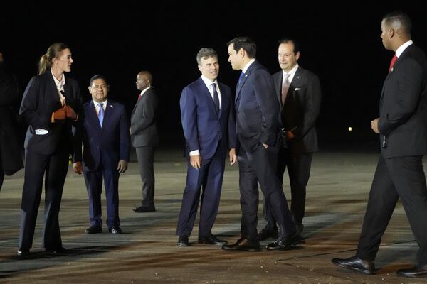 Secretary of State Marco Rubio, third from right, is received by Panamanian Foreign Minister Javier Martínez-Acha, second left, and John Barrett, Chargé d'affaires, at the international airport in Panama Pacifico, Saturday, Feb. 1, 2025. (AP Photo/Mark Schiefelbein, Pool)