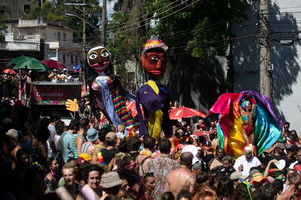 Revelers attend the Carmelitas street party on the first official day of Carnival in Rio de Janeiro, Friday, Feb. 28, 2025. (AP Photo/Bruna Prado)