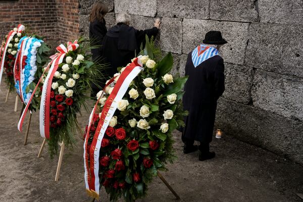 Survivors and relatives attend a ceremony at the Auschwitz-Birkenau former Nazi German concentration and extermination camp, in Oswiecim, Poland, Monday, Jan. 27. 2025.(AP Photo/Oded Balilty)