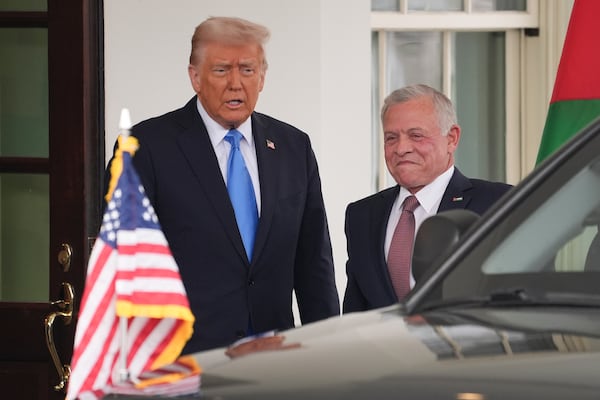 President Donald Trump greets Jordan's King Abdullah II at the White House, Tuesday, Feb. 11, 2025, in Washington. (AP Photo/Evan Vucci)