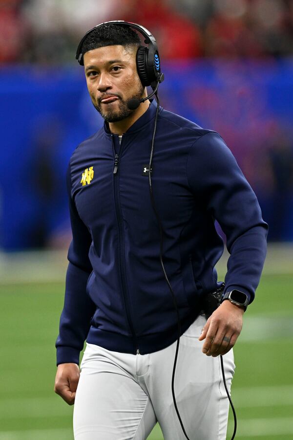 Notre Dame head coach Marcus Freeman watches from the sideline during the first half against Georgia in the quarterfinals of a College Football Playoff, Thursday, Jan. 2, 2025, in New Orleans. (AP Photo/Matthew Hinton)