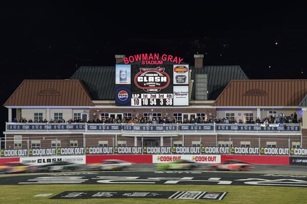 Drivers compete through Turn 4 during a qualifying heat for a NASCAR Cup Series auto race at Bowman Gray Stadium, Sunday, Feb. 2, 2025, in Winston-Salem, N.C. (AP Photo/Matt Kelley)