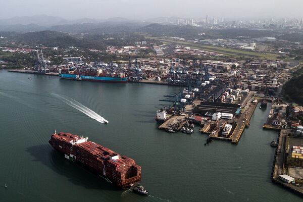 A cargo ship sails next to the Panama Canal's Balboa port, operated by the Panama Ports Company, in Panama City, Saturday, Feb. 1, 2025. (AP Photo/Matias Delacroix)