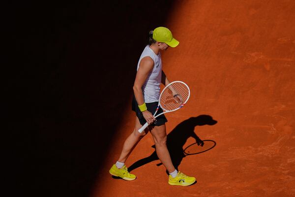 Iga Swiatek of Poland reacts during her match against United States' Coco Gauff during the Madrid Open tennis tournament in Madrid, Spain, Thursday, May 1, 2025. (AP Photo/Manu Fernandez)