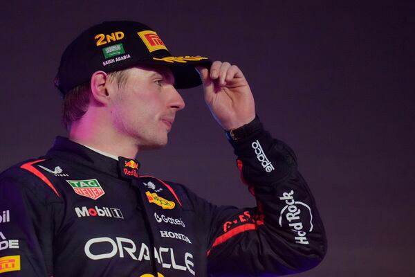 Second placed Red Bull driver Max Verstappen of the Netherlands gestures on the podium during the Formula One Saudi Arabian Grand Prix at the Jeddah Corniche Circuit in Jeddah, Saudi Arabia, Sunday, April 20, 2025. (AP Photo/Darko Bandic)