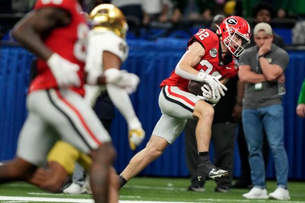 Georgia running back Cash Jones (32) catches a 32-yard touchdown pass during the second half against Notre Dame in the quarterfinals of a College Football Playoff, Thursday, Jan. 2, 2025, in New Orleans. (AP Photo/Gerald Herbert)