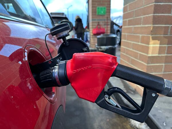FILE - A motorist fills up the tank of a vehicle at a Costco gasoline station late Sunday, Feb. 16, 2025, in Sheridan, Colo. (AP Photo/David Zalubowski, File)