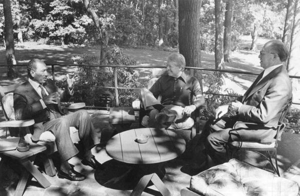 FILE - In this photo provided by the White House, the principals in the Middle East Summit, from left, Egyptian President Anwar Sadat, U.S. President Jimmy Carter, and Israeli Prime Minister Menachem Begin, meet for the first time at Camp David, Md., Sept, 6, 1978. (White House via AP, File)