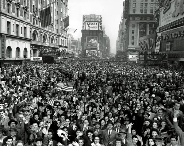 FILE - Looking north from 44th Street, New York's Times Square is packed Monday, May 7, 1945, with crowds celebrating the news of Germany's unconditional surrender in World War II. (AP Photo/Tom Fitzsimmons, File)