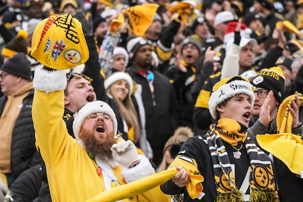 Pittsburgh Steelers fans cheer during the first half of an NFL football game between the Pittsburgh Steelers and the Kansas City Chiefs, Wednesday, Dec. 25, 2024, in Pittsburgh. (AP Photo/Gene J. Puskar)