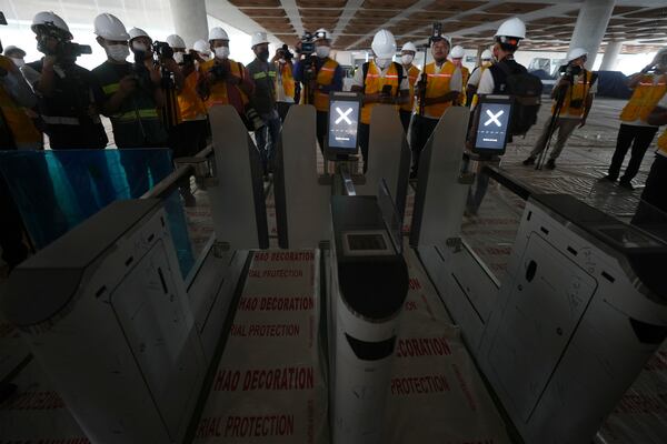 Cambodian journalists visit inside an under construction of a new airport of Techo International Airport at the outskirts of Phnom Penh Cambodia, Friday, March 21, 2025. (AP Photo/Heng Sinith)