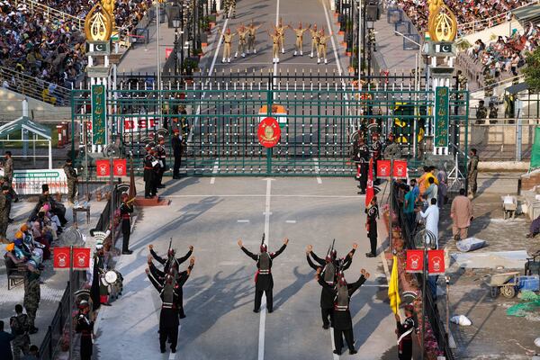 Pakistan's Rangers soldiers, bottom, and Indian Border Security Forces soldiers, top, parade during a daily closing ceremony at the Wagah, a joint post on the Pakistan and India border, near Lahore, Pakistan, Monday, May 5, 2025. (AP Photo/K.M. Chaudary)