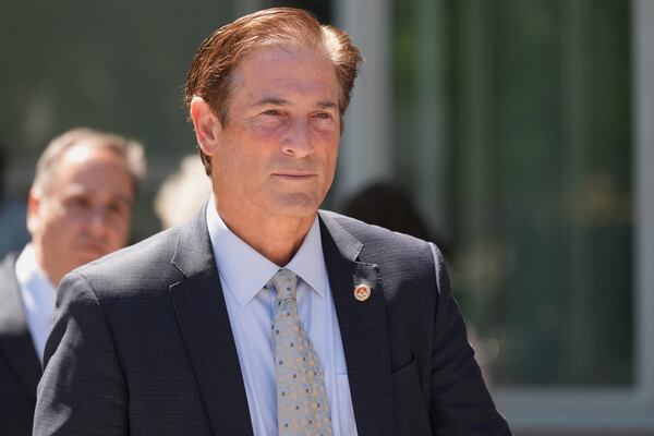 Los Angeles County District Attorney Nathan Hochman walks out of the courthouse after a hearing in the case of Erik and Lyle Menendez Friday, May 9, 2025, in Los Angeles. (AP Photo/Jae C. Hong)
