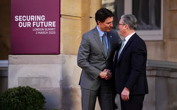 Canada Prime Minister Justin Trudeau is greeted by British Prime Minister Keir Starmer, right, as he arrives to the Securing our Future Summit on Ukraine and European security at Lancaster House in London, Sunday, March 2, 2025. (Sean Kilpatrick/The Canadian Press via AP)