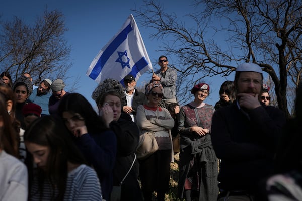 Mourners attend the funeral of Rachel Cohen, 73, and Aliza Raiz, 70, who were killed yesterday in a Palestinian shooting attack in the West Bank, at a cemetery in the West Bank Jewish settlement of Kdumim, Tuesday, Jan. 7, 2025. (AP Photo/Ohad Zwigenberg)