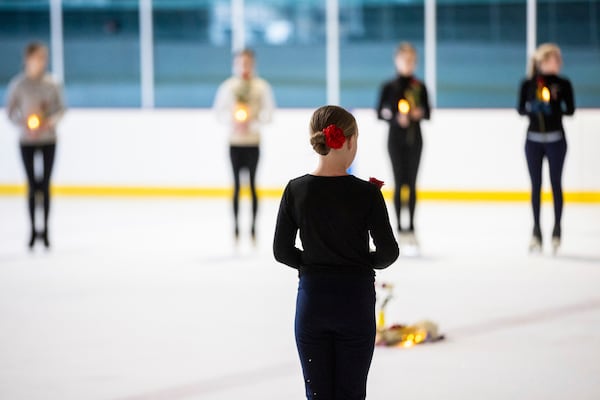 The Cottonwood Heights Figure Skating Club, in unity with skating clubs nationwide and U.S. Figure Skating, holds a vigil in honor of the lives lost in Flight AA5342 at the Cottonwood Heights Recreation Center in Cottonwood Heights, Utah, on Monday, Feb. 3, 2025. (Tess Crowley/The Deseret News via AP)