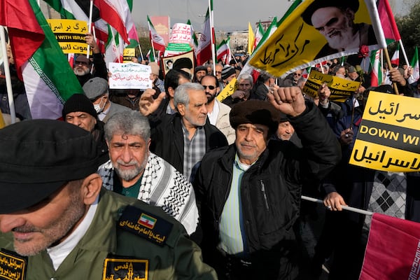 Iranian worshippers chant slogans as they attend a rally to celebrate the announcement of a ceasefire deal between Hamas and Israel after their Friday prayers, in Tehran, Iran, Friday, Jan. 17, 2025. (AP Photo/Vahid Salemi)