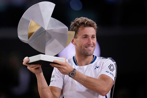 Norway's Casper Ruud holds the trophy after winning the Madrid Open tennis final in Madrid, Spain, Sunday, May 4, 2025. (AP Photo/Manu Fernandez)
