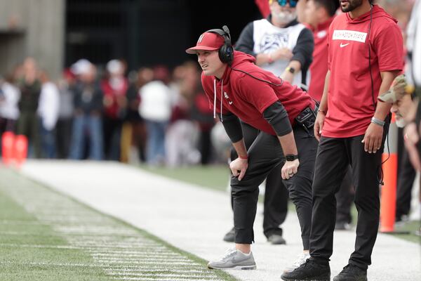 FILE - Washington State head coach Jake Dickert, center, watches the first half of an NCAA college football game, Saturday, Oct. 19, 2024, in Pullman, Wash. (AP Photo/Young Kwak, File)