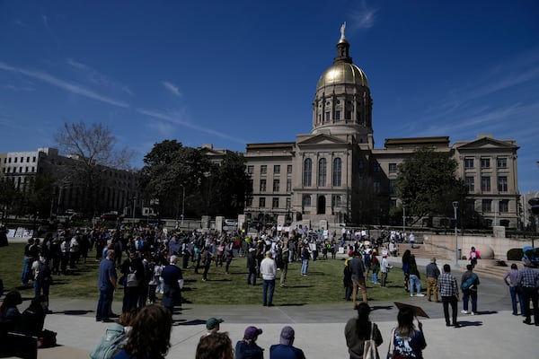 People attend a Stand up for Science rally in Liberty Plaza near the Georgia State capitol on Friday, March 7, 2025, in Atlanta. (AP Photo/Brynn Anderson)