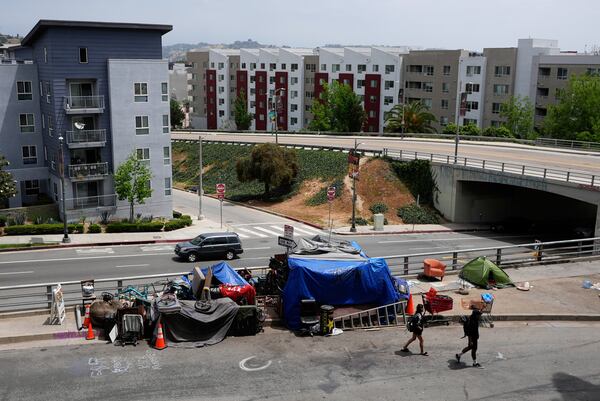 Tents are set up in a homeless encampment Monday, May 12, 2025, in Los Angeles. (AP Photo/Damian Dovarganes)
