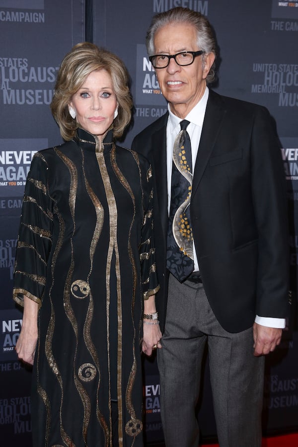 FILE - Jane Fonda, left, and Richard Perry arrive at the 2016 What You Do Matters Dinner at the The Beverly Hilton Hotel, March 2, 2016, in Beverly Hills, Calif. (Photo by Rich Fury/Invision/AP, File)