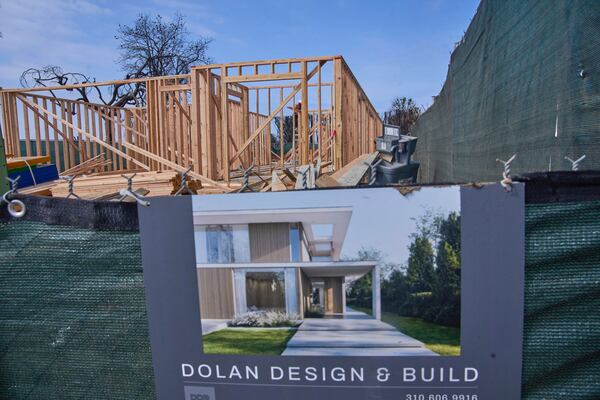 A home is rebuilt in the Palisades Fire damage zone in the Pacific Palisades neighborhood of Los Angeles, Thursday, April 24, 2025. (AP Photo/Damian Dovarganes)