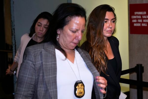 Miriam Haley, right, an accuser testifying at Harvey Weinstein's rape trial, leaves the courtroom during a break in New York, Wednesday, April 30, 2025. (AP Photo/Seth Wenig)
