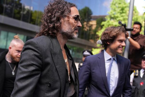 English comedian and actor Russell Brand arrives at Southwark Crown Court where he is charged with rape and sexual assault in London, Friday, May 30, 2025.(AP Photo/Alastair Grant)