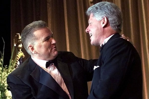 FILE - Longtime democratic activist David Mixner, left, introduces President Clinton for a speech to the Access Now for Gay and Lesbian Equality (ANGLE) dinner at the Beverly Hilton Hotel, Oct. 2, 1999, in Los Angeles, California. (AP Photo/Khue Bui, File)