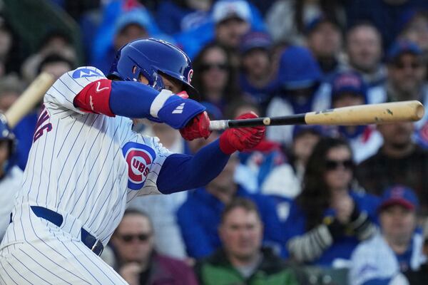 Chicago Cubs' Pete Crow-Armstrong hits a one-run double during the second inning of a baseball game against the Philadelphia Phillies in Chicago, Sunday, April 27, 2025. (AP Photo/Nam Y. Huh)