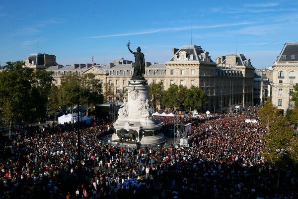 FILE - Supporters of French far-left leader Jean-Luc Melenchon are gathered on Republique square to listen their leader during a protest over the president's labor reform, in Paris, France, Saturday, Sept. 23, 2017. (AP Photo/Francois Mori, File)